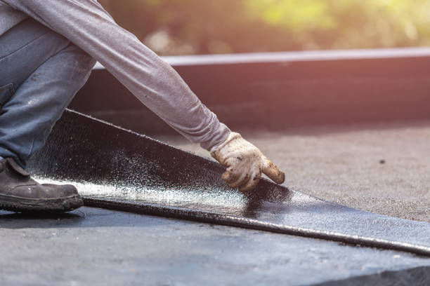 Professional Basement Waterproofing technician working in Linwood, NY